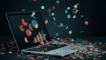 Computer met confetti in dezelfde kleur als data op scherm